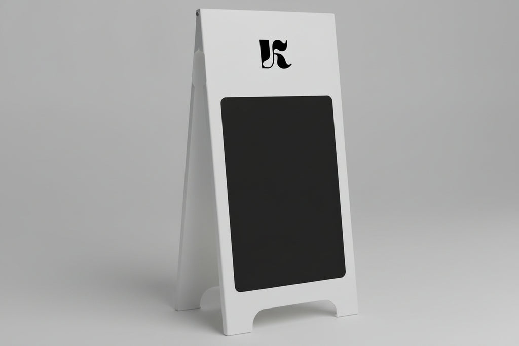 White a-frame sign with black chalkboard surface and logo on a gray background