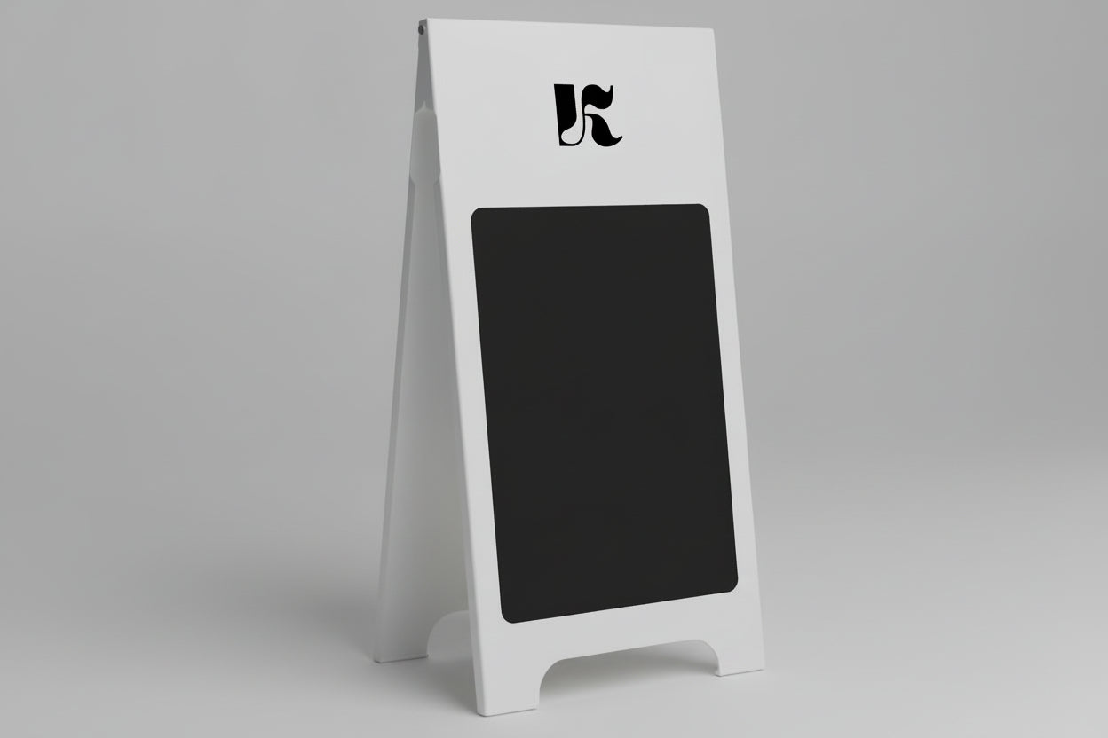 White a-frame sign with black chalkboard surface and logo on a gray background