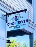 Rigid hanging sign at cool river coffee shop