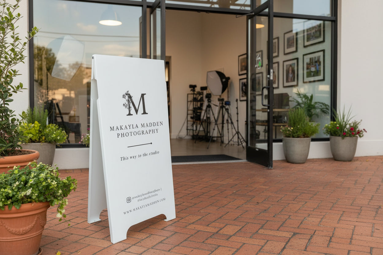 Outdoor setting with a 'Makayla Madden Photography' sign in front of a building entrance.