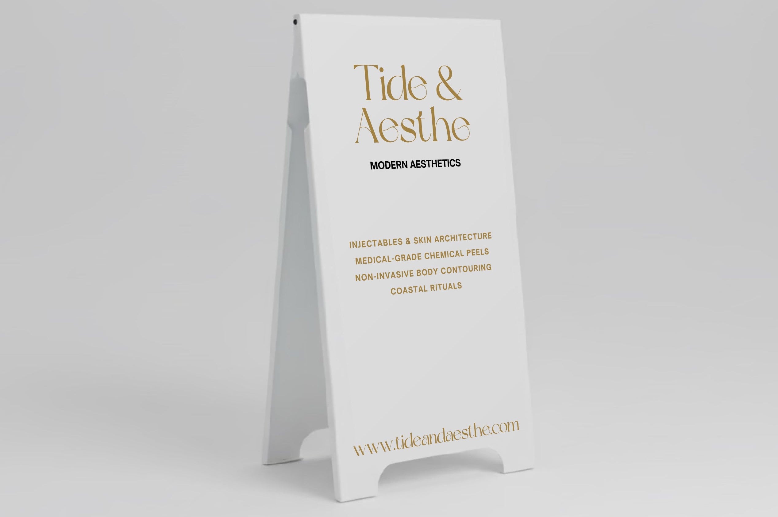 Tide & Aesthe sign on a stand against a gray background